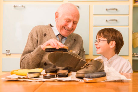 Grandpa and grandson shoe shine fun